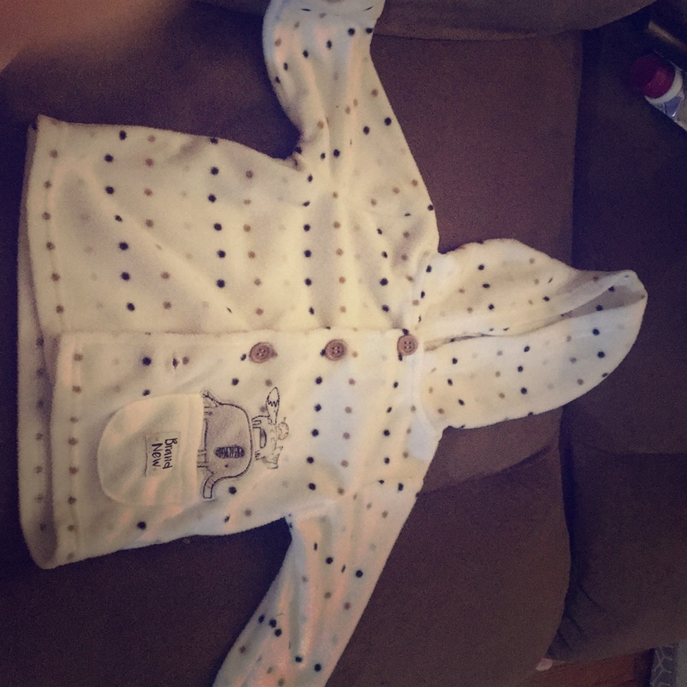 White with polka dots baby sweater.